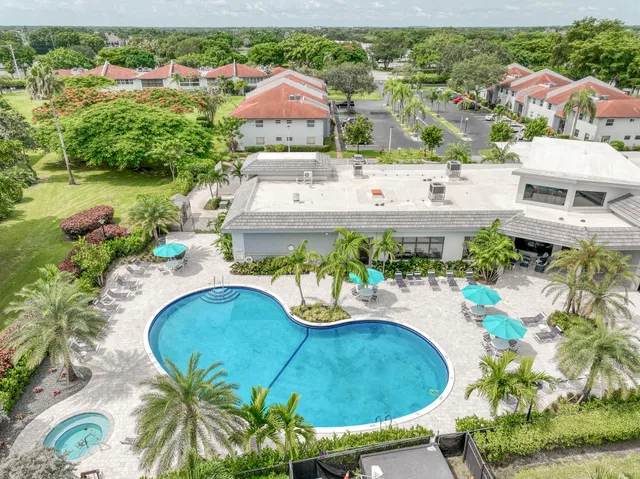 an aerial view of a house with outdoor space