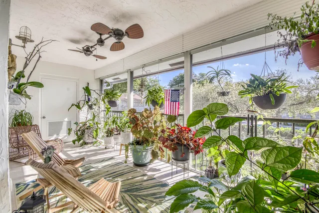 a view of a entryway with flower pots