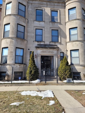 4546 South Indiana Avenue, Unit 2N Chicago, IL 60653 - Photo 1 of 16 a front view of a building with a yard