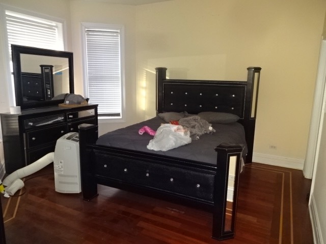 4546 South Indiana Avenue, Unit 2N Chicago, IL 60653 - Photo 10 of 16 a bed room with a bed and a dresser