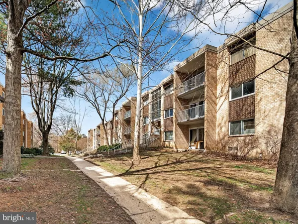 a view of a house with snow on the road