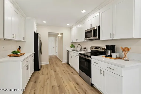 a view of storage and utility room with washer and dryer