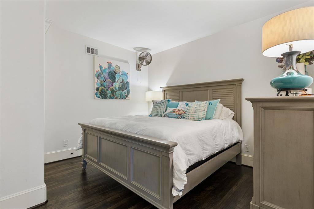 1306 Morrow Road Valley View, TX 76272 - Photo 23 of 40 a bed sitting in a bedroom next to a lamp
