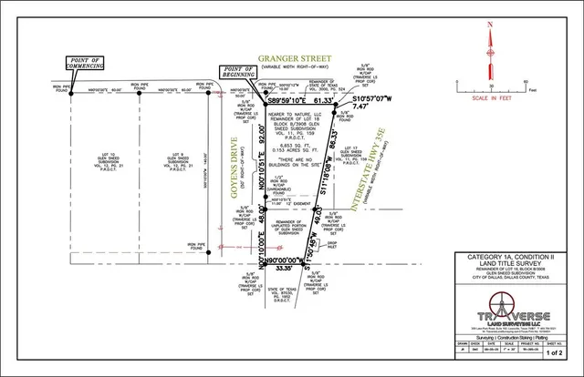 a view of a yard in front of a house with a large tree