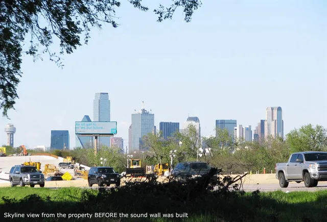 a view of a city with tall buildings