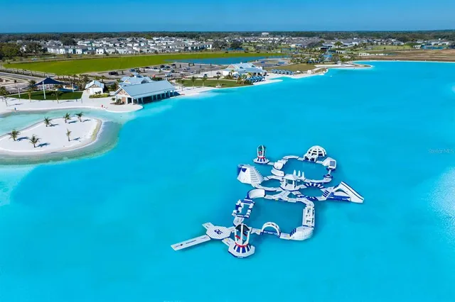 a front view of a lake with lots of trees