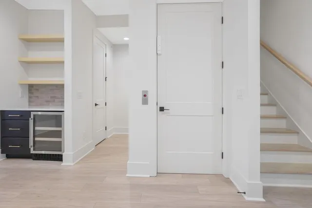 a bathroom with a granite countertop sink a toilet and shower
