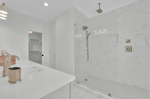 a view of a kitchen with a sink and cabinets