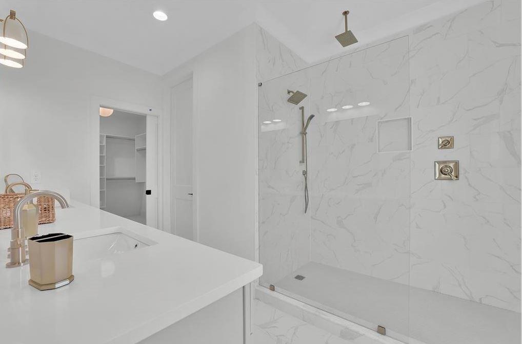 332 Sugarview Road, Unit 16 Sugar Hill, GA 30518 - Photo 15 of 31 a bathroom with a granite countertop sink a toilet and shower
