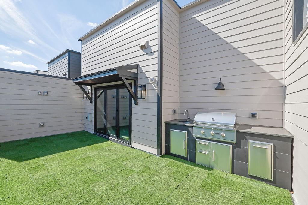 332 Sugarview Road, Unit 16 Sugar Hill, GA 30518 - Photo 17 of 31 a view of a kitchen with a sink and cabinets