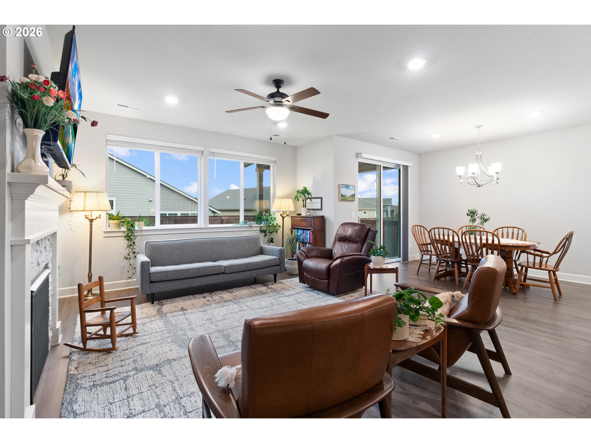 4935 South 16th Drive Ridgefield, WA 98642 - Photo 13 of 47 a living room with furniture a dining table and a potted plant