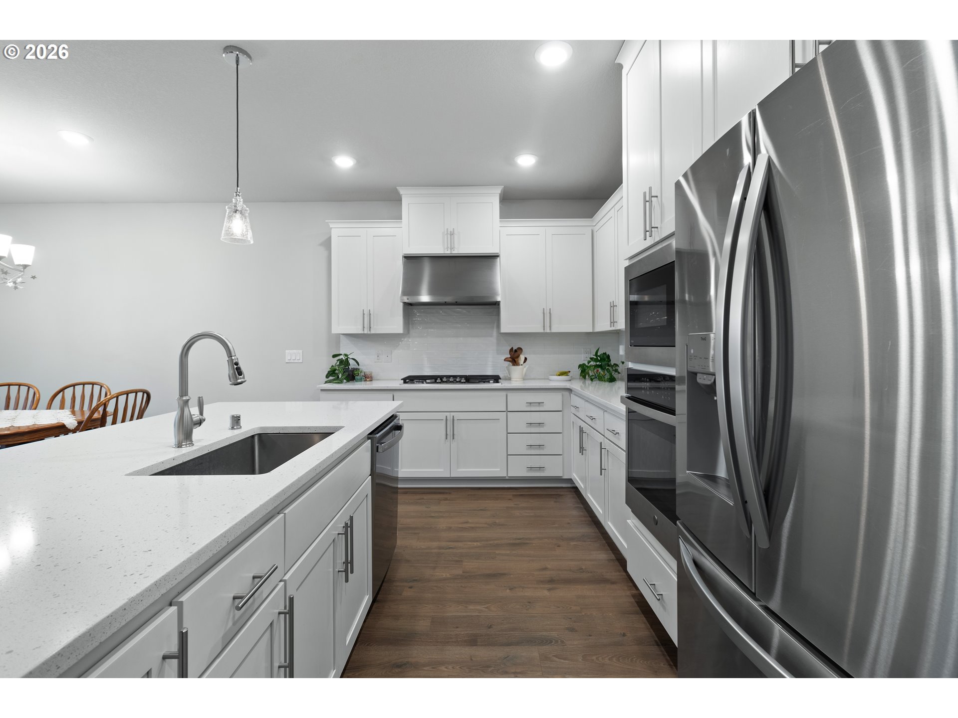 4935 South 16th Drive Ridgefield, WA 98642 - Photo 21 of 47 a kitchen with refrigerator cabinets and a sink