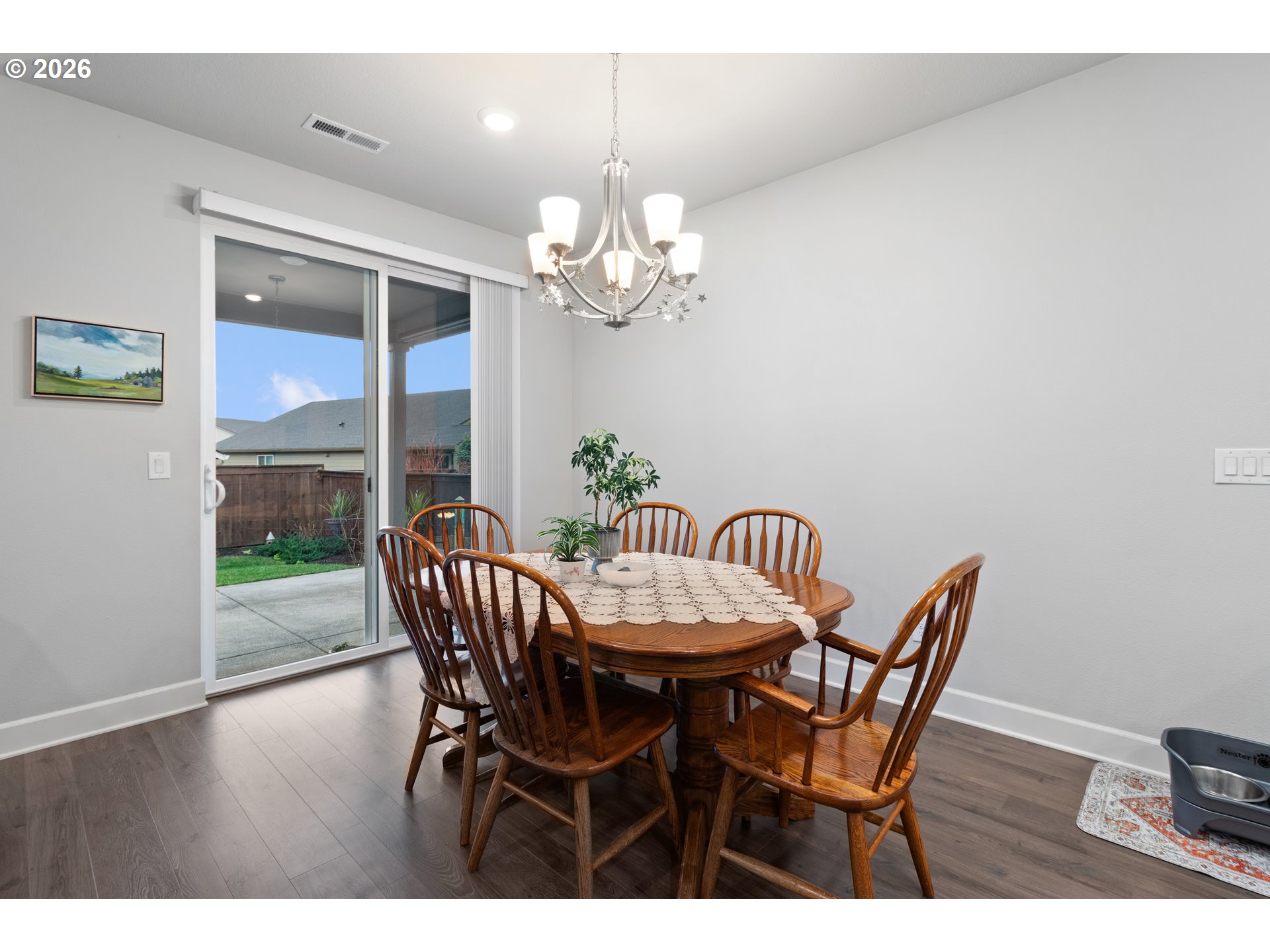 4935 South 16th Drive Ridgefield, WA 98642 - Photo 23 of 47 a view of a dining room with furniture a chandelier and wooden floor