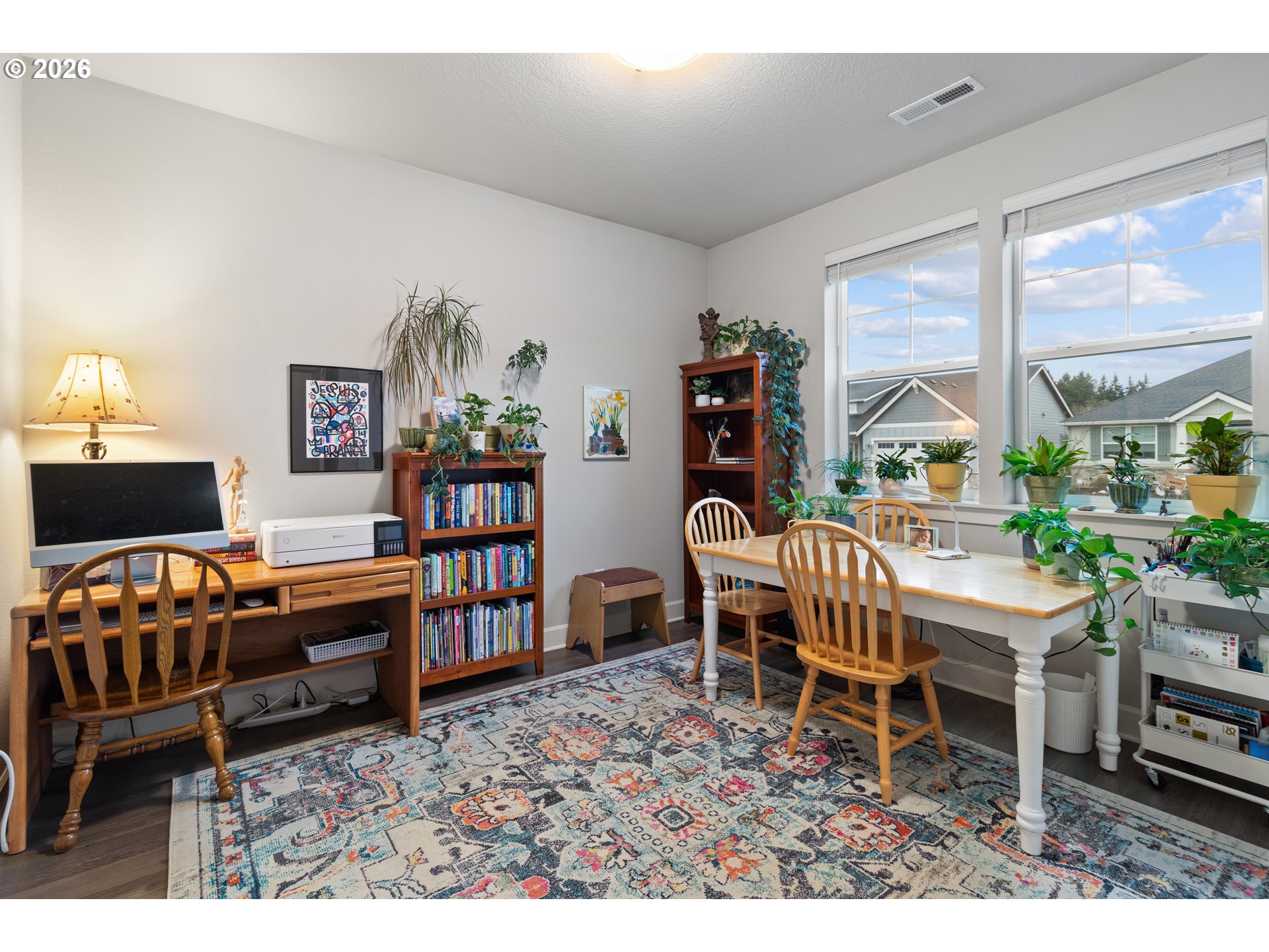 4935 South 16th Drive Ridgefield, WA 98642 - Photo 33 of 47 a living room with furniture a piano and a bookshelf