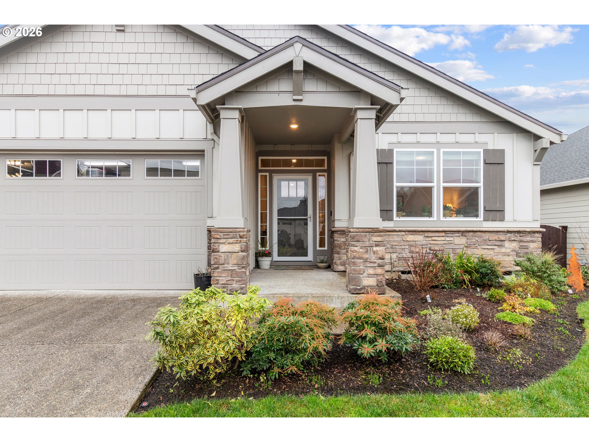 4935 South 16th Drive Ridgefield, WA 98642 - Photo 4 of 47 a front view of a house with garden