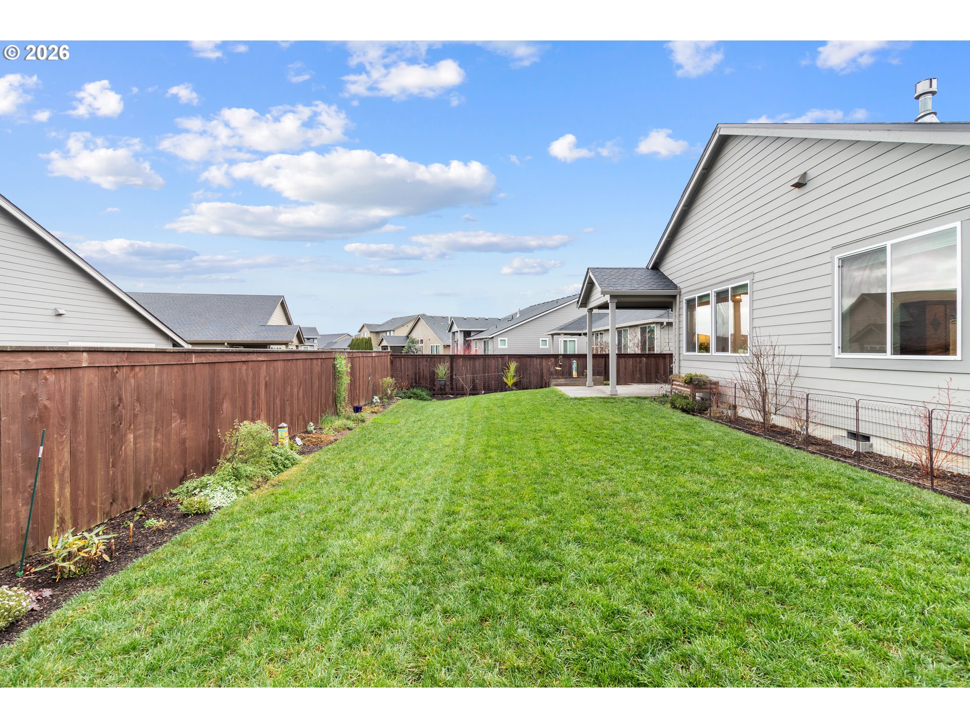 4935 South 16th Drive Ridgefield, WA 98642 - Photo 42 of 47 a view of a house with backyard and a tree