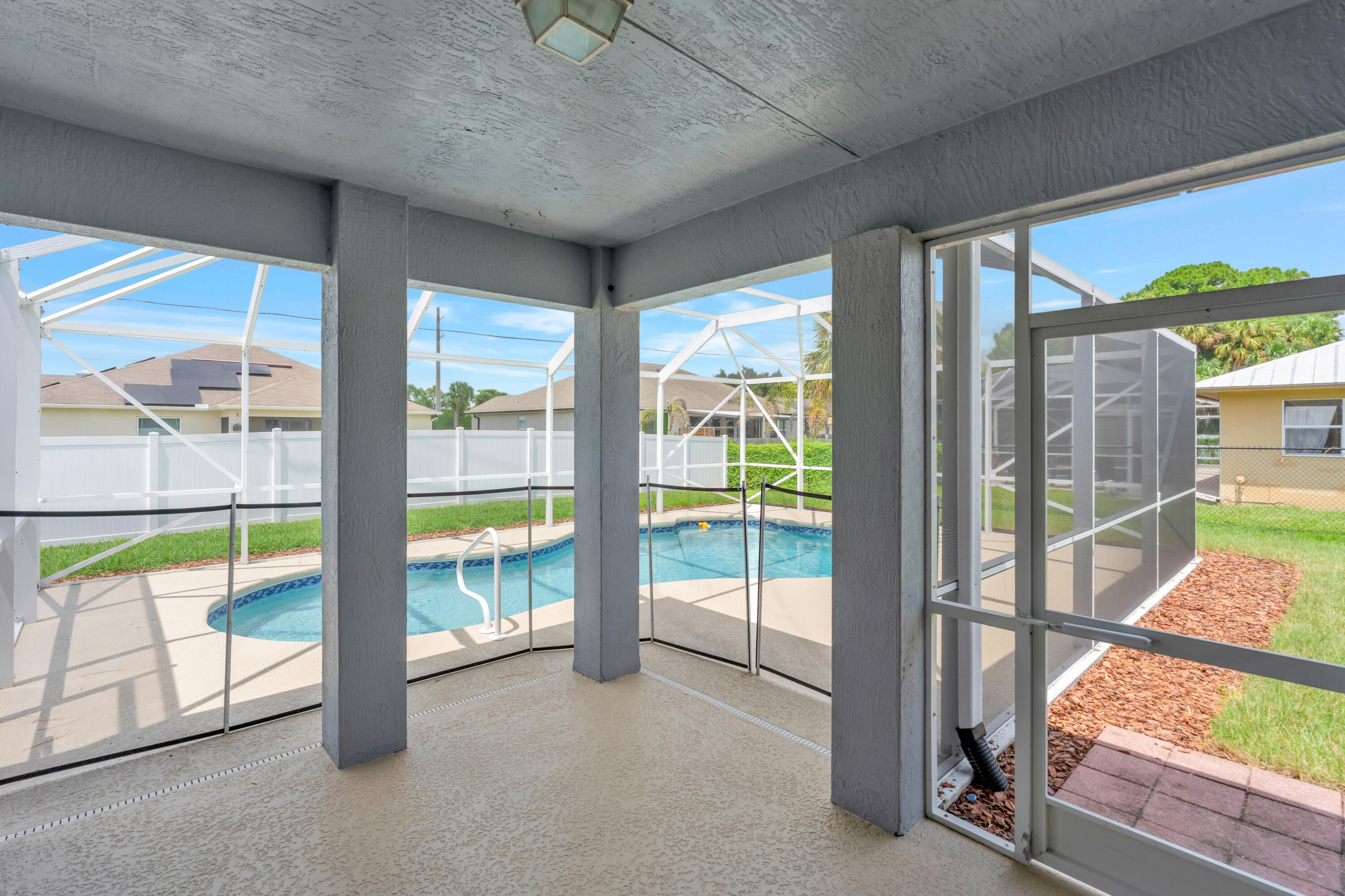 2320 Southwest Madrid Road Port St. Lucie, FL 34953 - Photo 29 of 46 Screened Patio