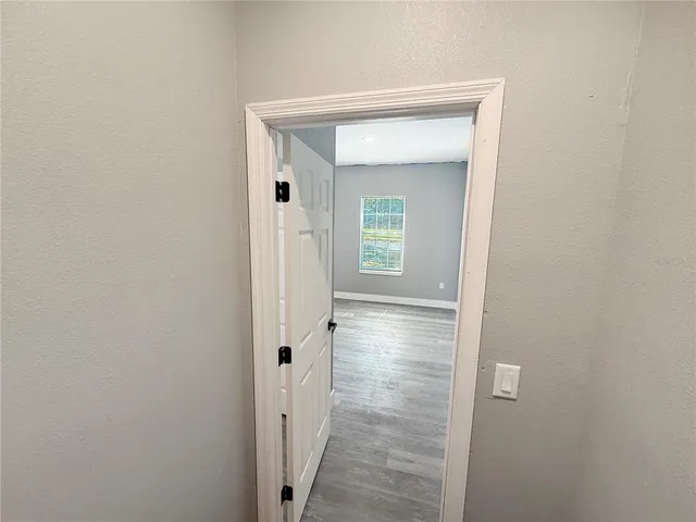 a view of a bathroom from a hallway