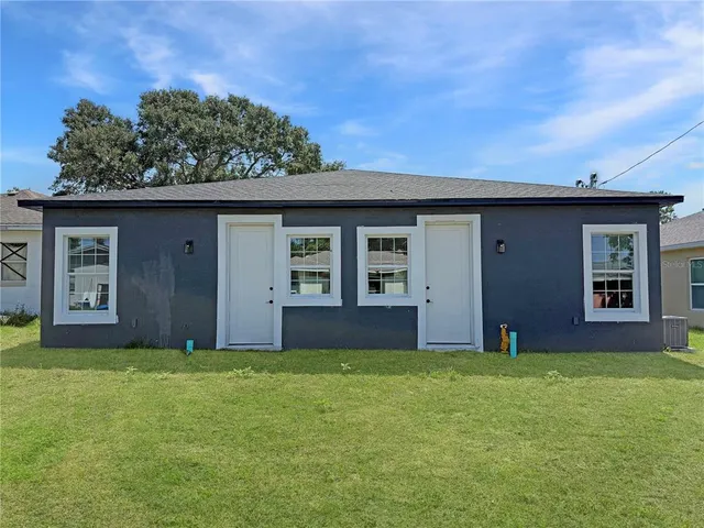 front view of a house with a yard
