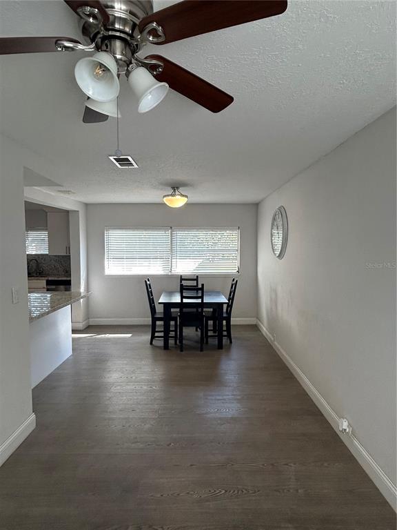 48 East Par Street Orlando, FL 32804 - Photo 16 of 25 a view of a dining room with furniture and chandelier