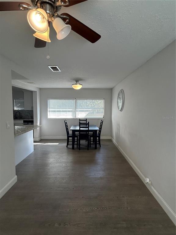 48 East Par Street Orlando, FL 32804 - Photo 18 of 25 a view of a dining room with furniture and chandelier