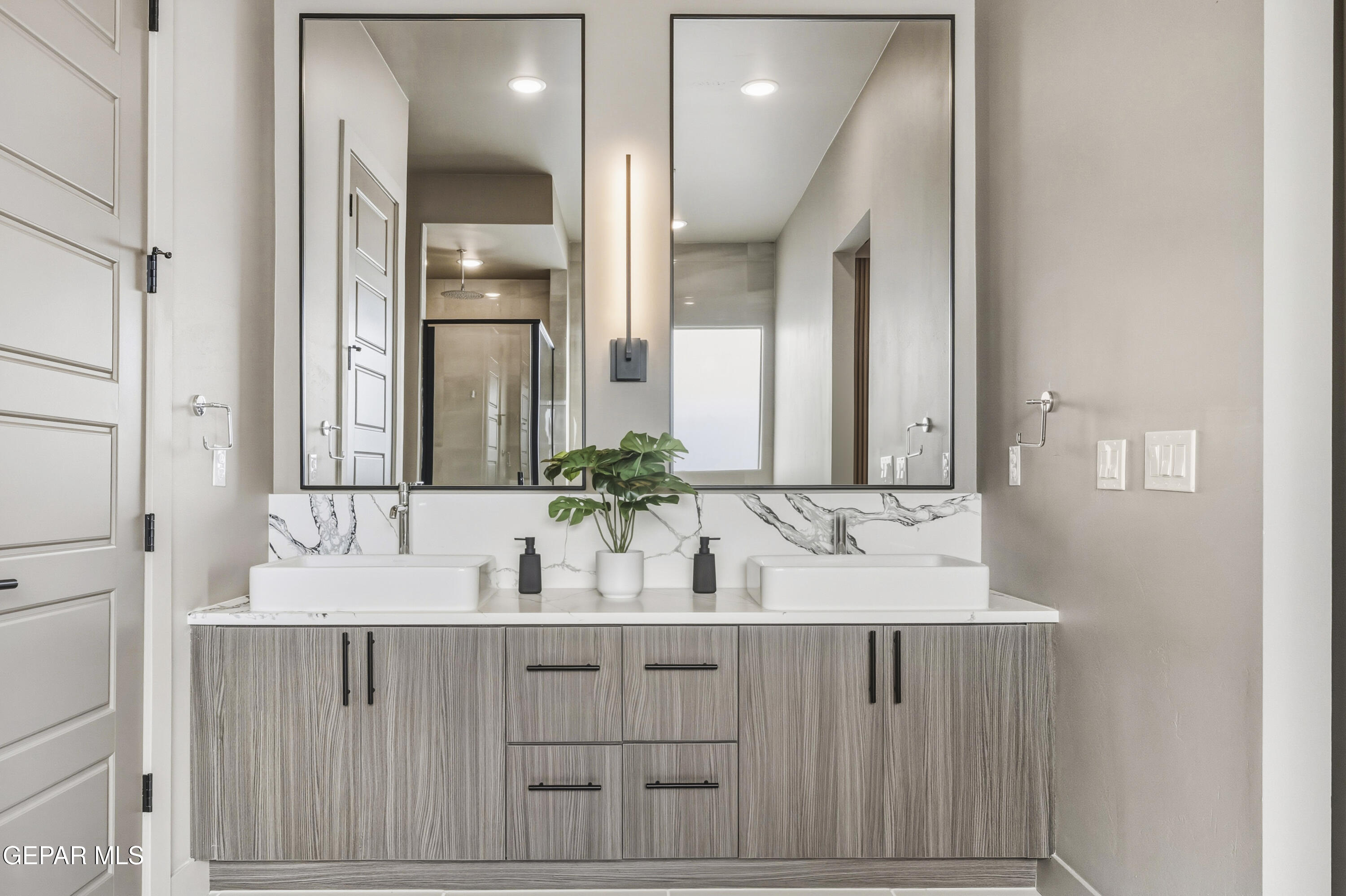 1860 War Path El Paso, TX 79911 - Photo 12 of 12 a bathroom with a double vanity sink and a mirror