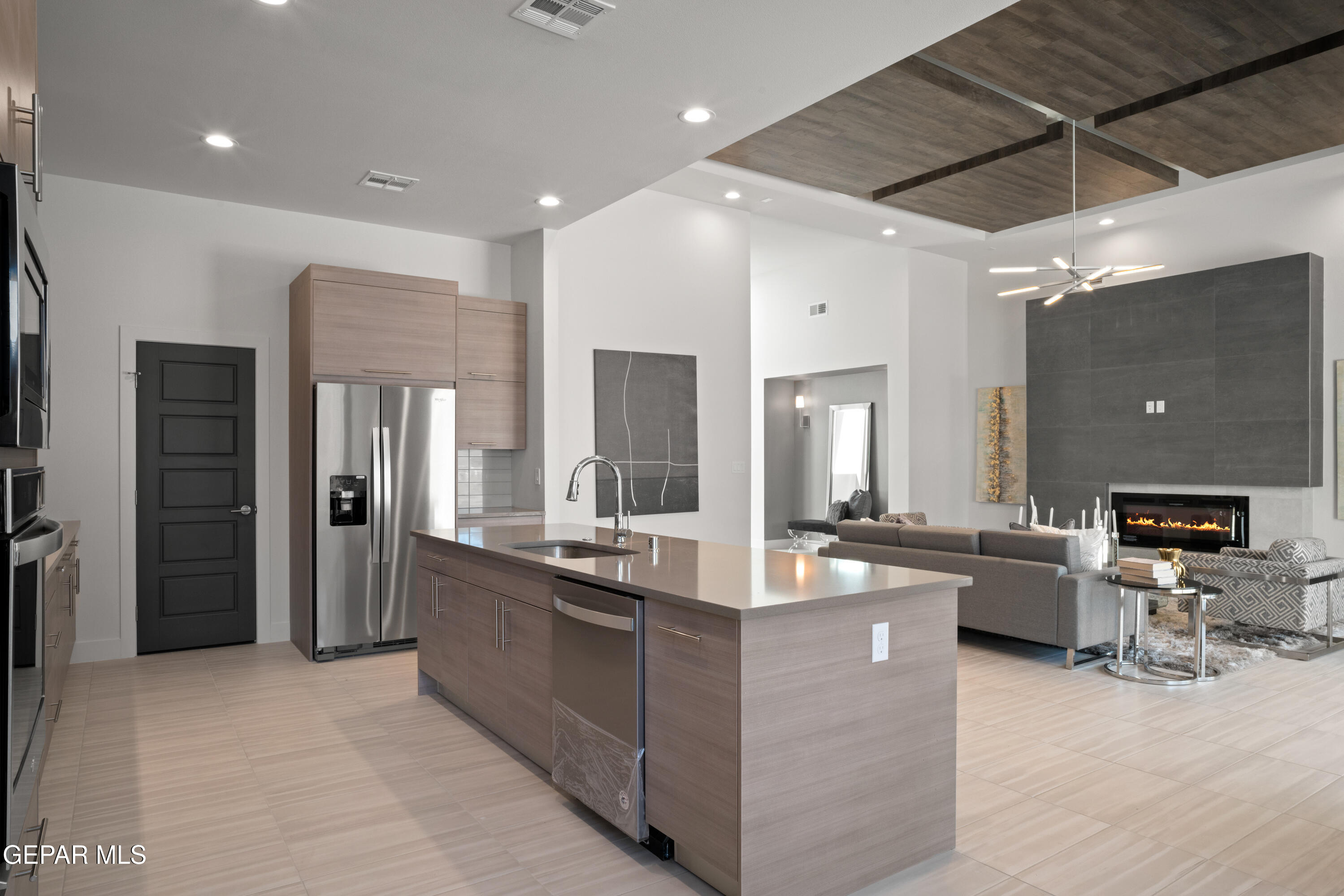 1860 War Path El Paso, TX 79911 - Photo 2 of 12 a large kitchen with stainless steel appliances kitchen island granite countertop a large counter top stainless steel appliances and cabinets