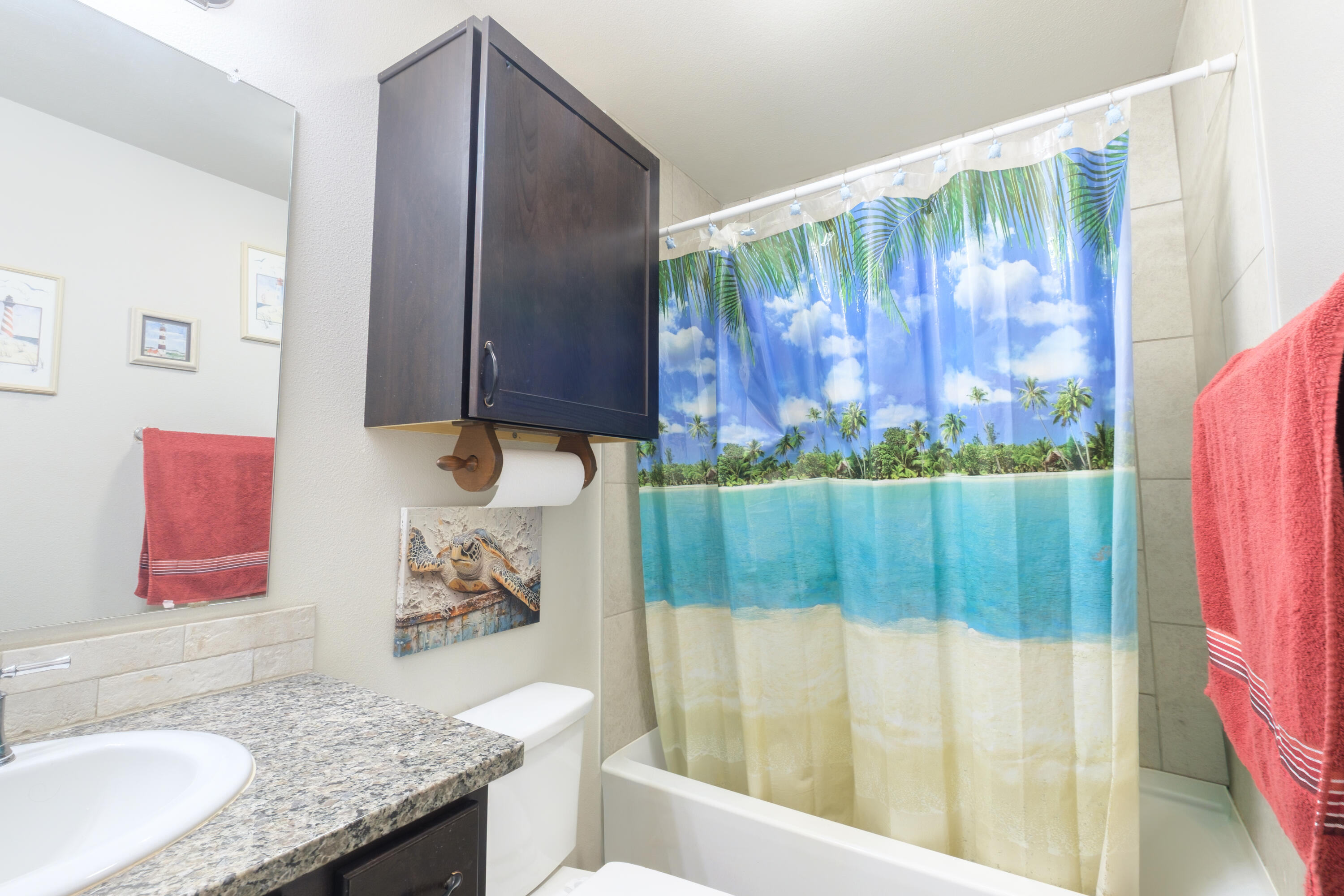 6821 39th Street Lubbock, TX 79407 - Photo 15 of 25 a bathroom with a granite countertop sink and a mirror