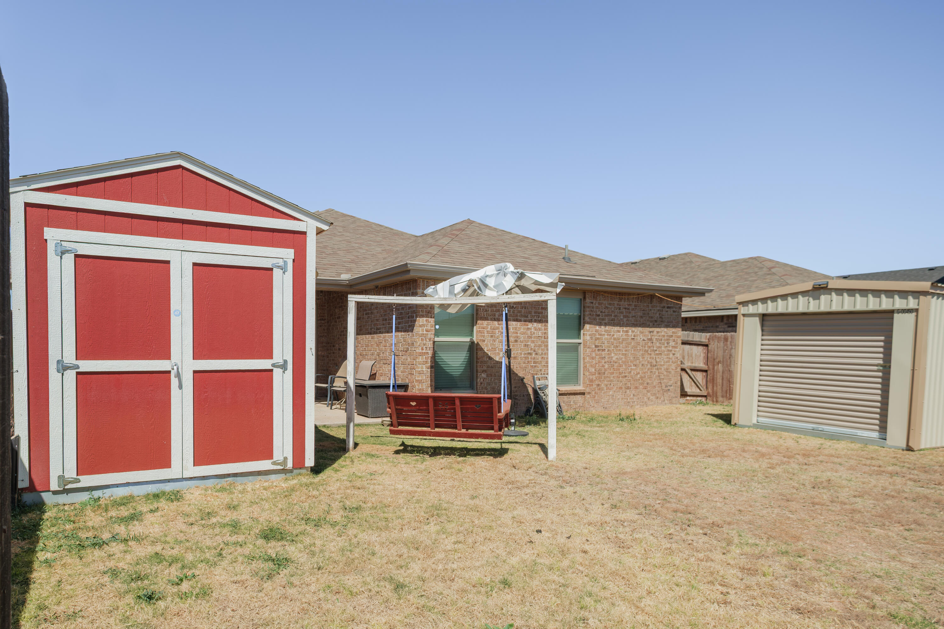 6821 39th Street Lubbock, TX 79407 - Photo 18 of 25 a front view of a house with a yard