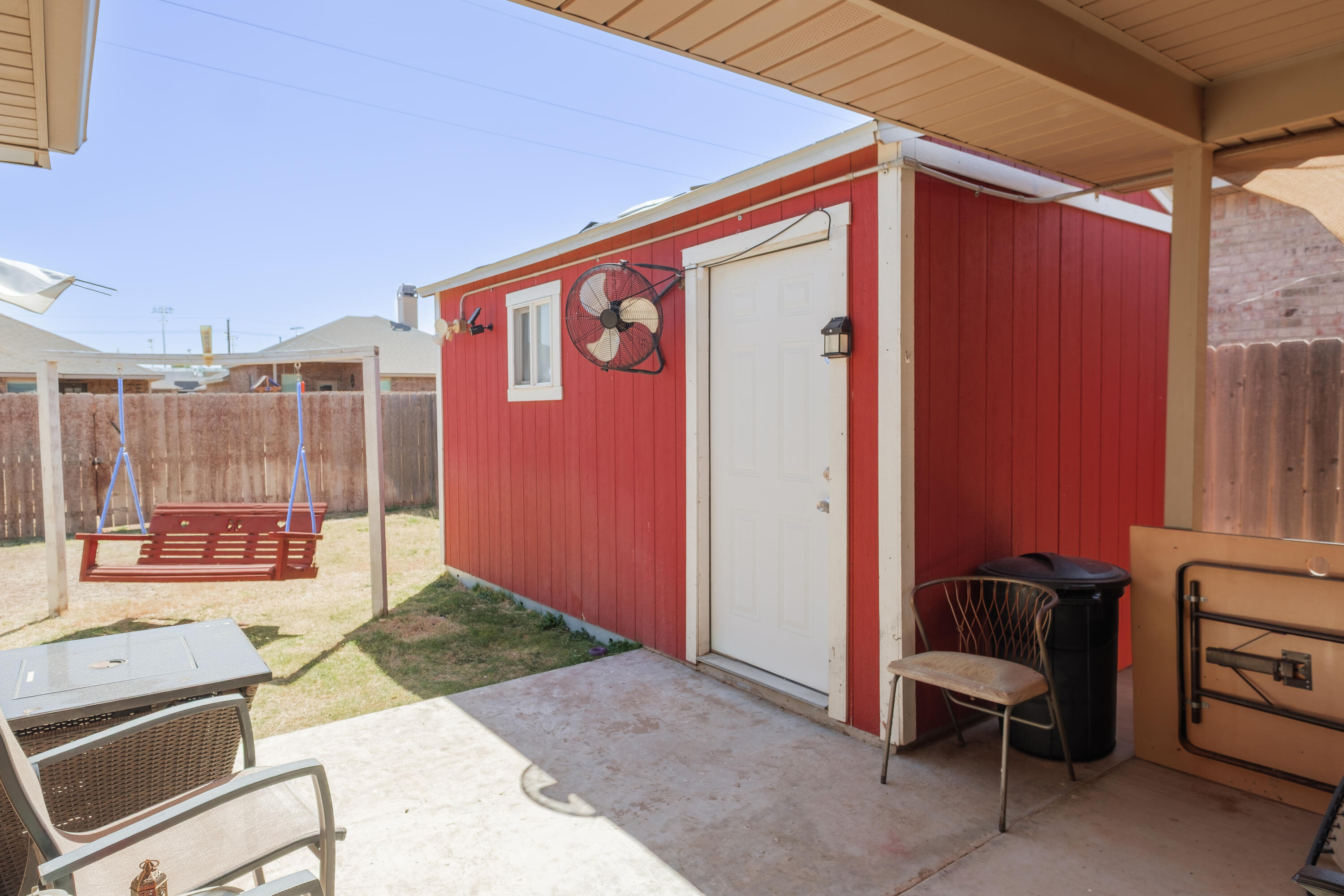 6821 39th Street Lubbock, TX 79407 - Photo 20 of 25 a patio with table and chairs