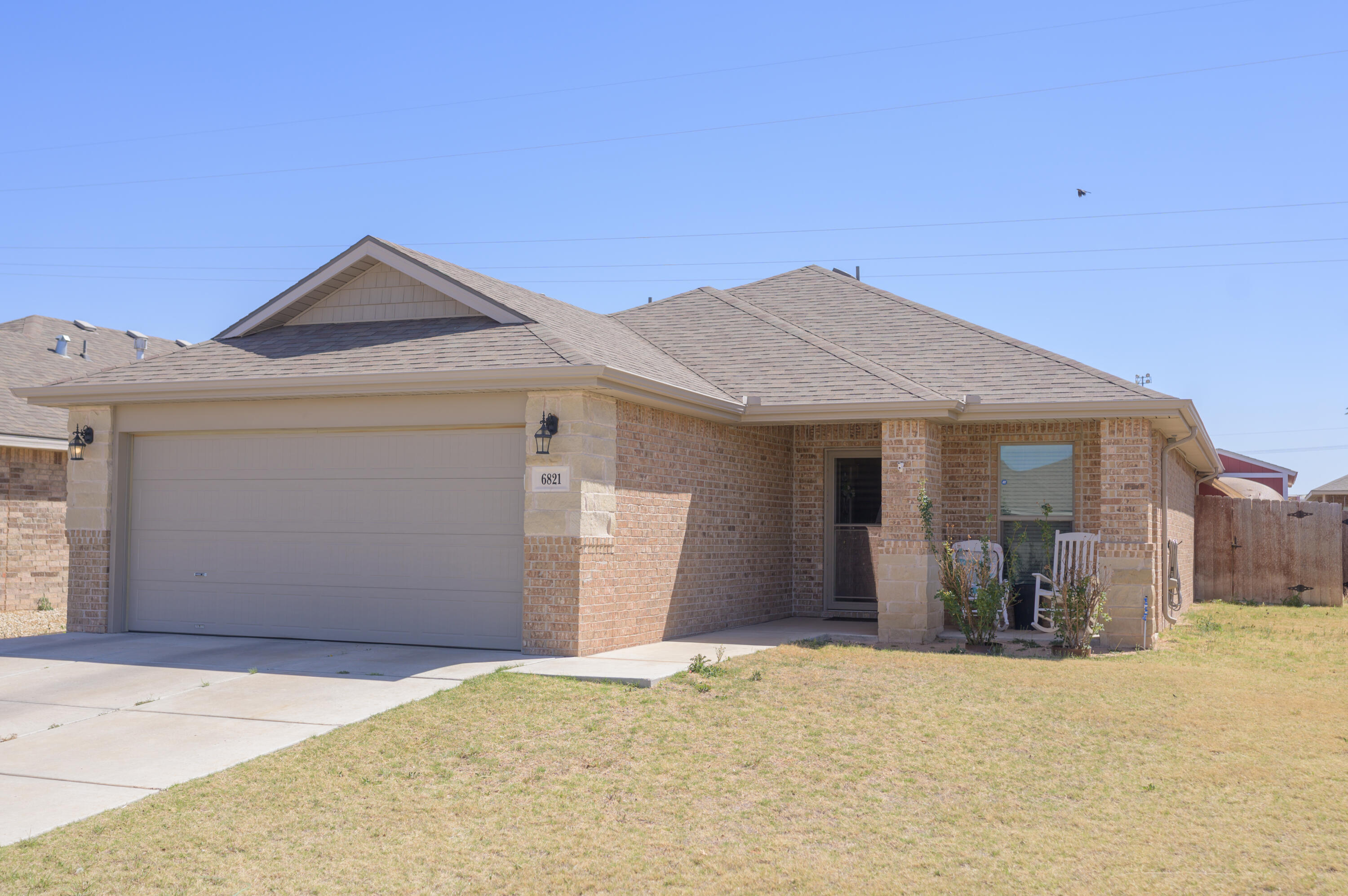 6821 39th Street Lubbock, TX 79407 - Photo 2 of 25 a view of a house with a snow in the background