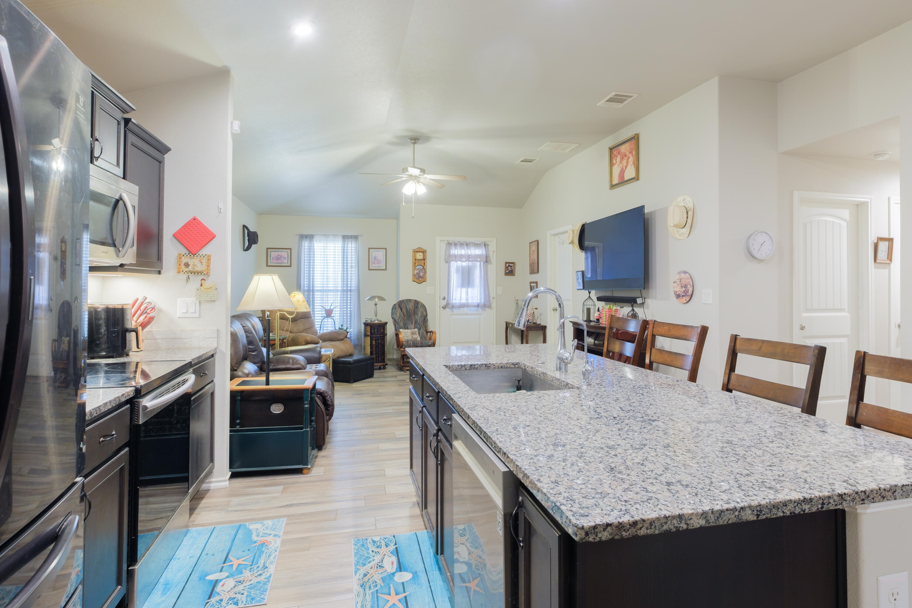 6821 39th Street Lubbock, TX 79407 - Photo 7 of 25 a kitchen with granite countertop lots of counter top space