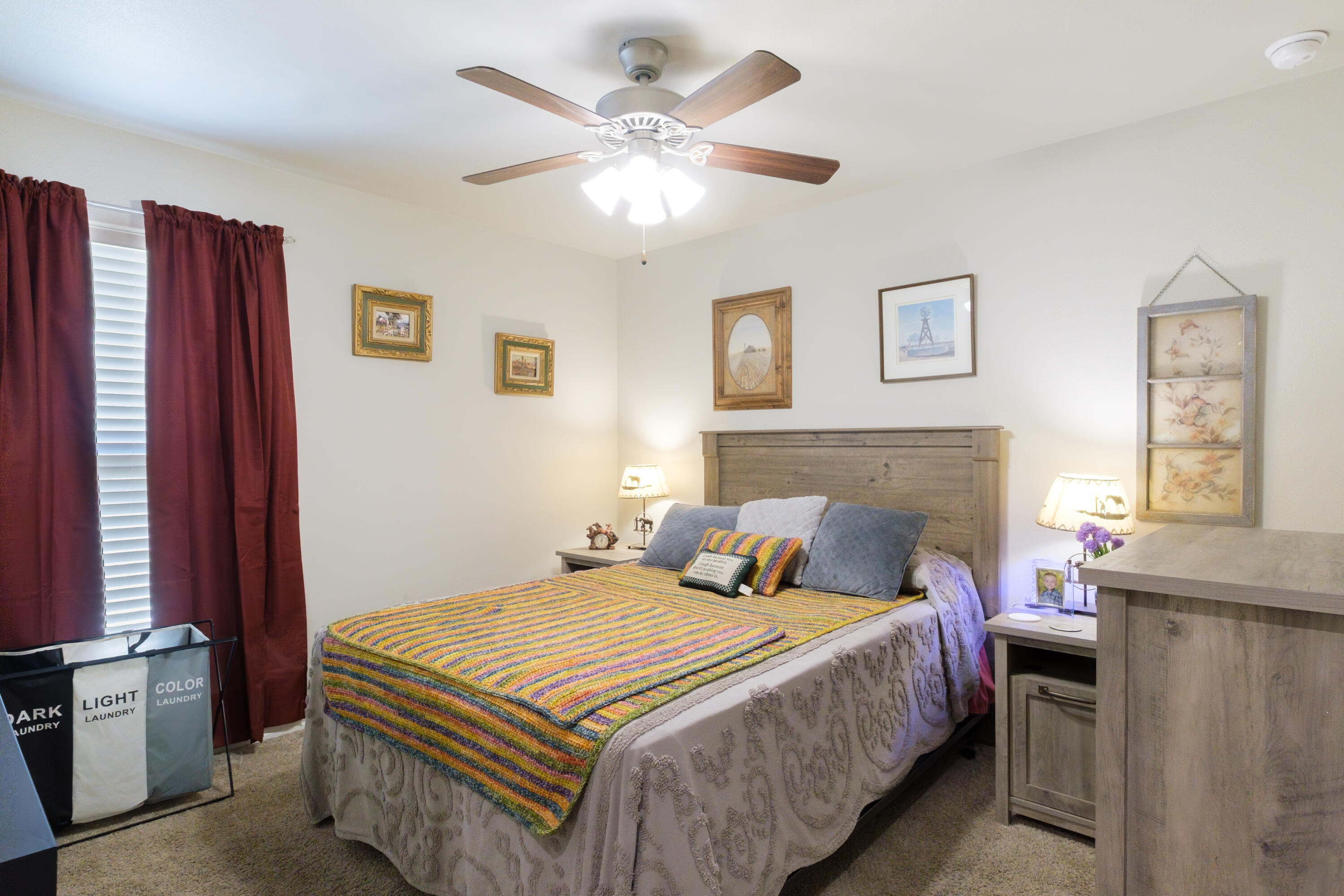 6821 39th Street Lubbock, TX 79407 - Photo 9 of 25 a bedroom with bed and a window