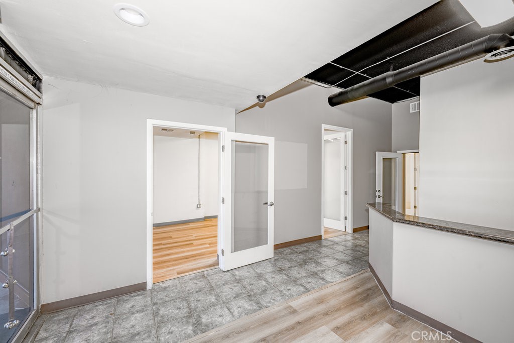 24609 Arch Street Newhall, CA 91321 - Photo 5 of 23 front desk with view to large office