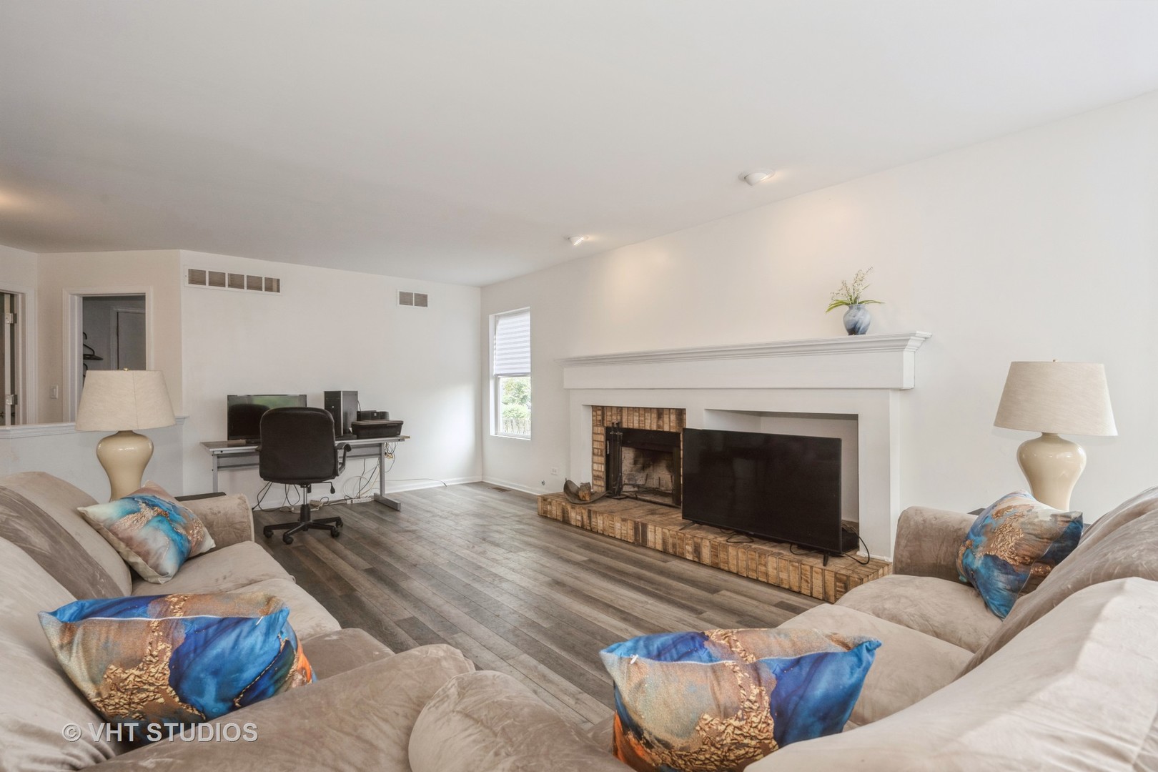 583 Greystone Lane Bolingbrook, IL 60440 - Photo 11 of 28 a living room with furniture and a fireplace