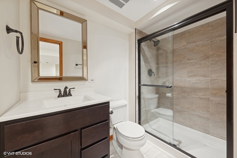 1114 Taft Avenue Wheaton, IL 60189 - Photo 11 of 24 a bathroom with a sink and a mirror