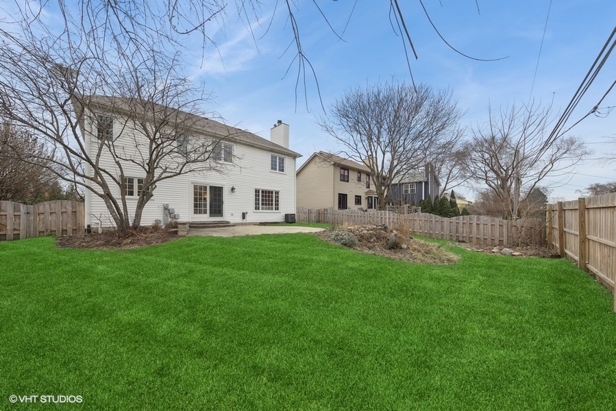 1114 Taft Avenue Wheaton, IL 60189 - Photo 19 of 24 a view of a white house with a yard