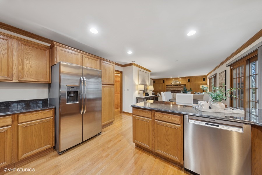 1114 Taft Avenue Wheaton, IL 60189 - Photo 5 of 24 a kitchen with stainless steel appliances granite countertop a refrigerator a stove and a sink with cabinets