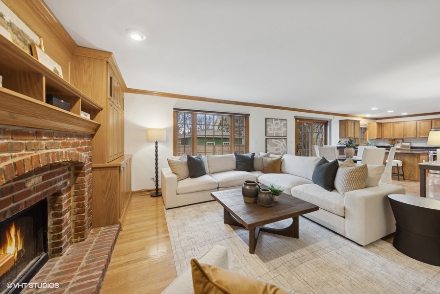 1114 Taft Avenue Wheaton, IL 60189 - Photo 7 of 24 a living room with furniture wooden floor and a fireplace