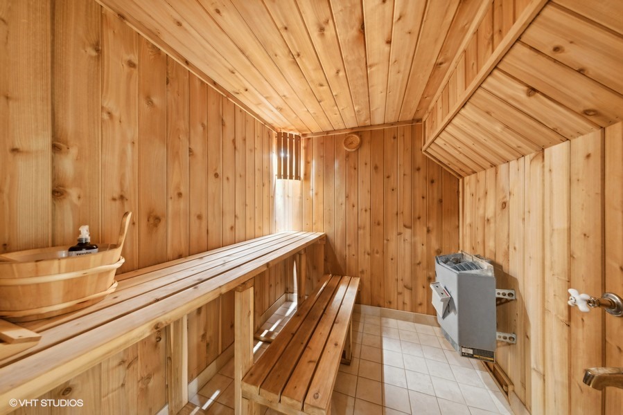 1114 Taft Avenue Wheaton, IL 60189 - Photo 10 of 24 a bathroom with a sink and a large mirror