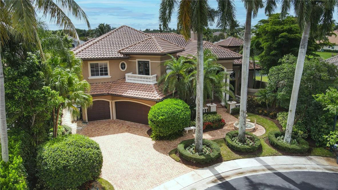 6468 Northwest 31st Way Boca Raton, FL 33496 - Photo 1 of 43 a front view of a house with a garden