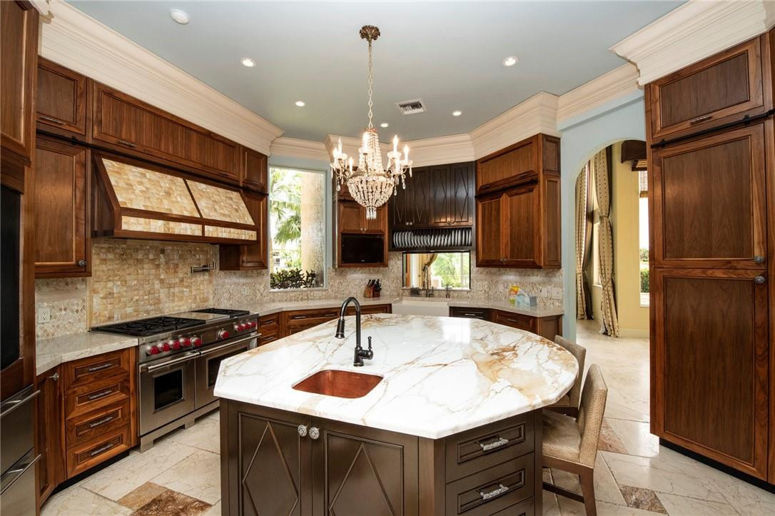 6468 Northwest 31st Way Boca Raton, FL 33496 - Photo 14 of 43 a kitchen with a sink stove and refrigerator