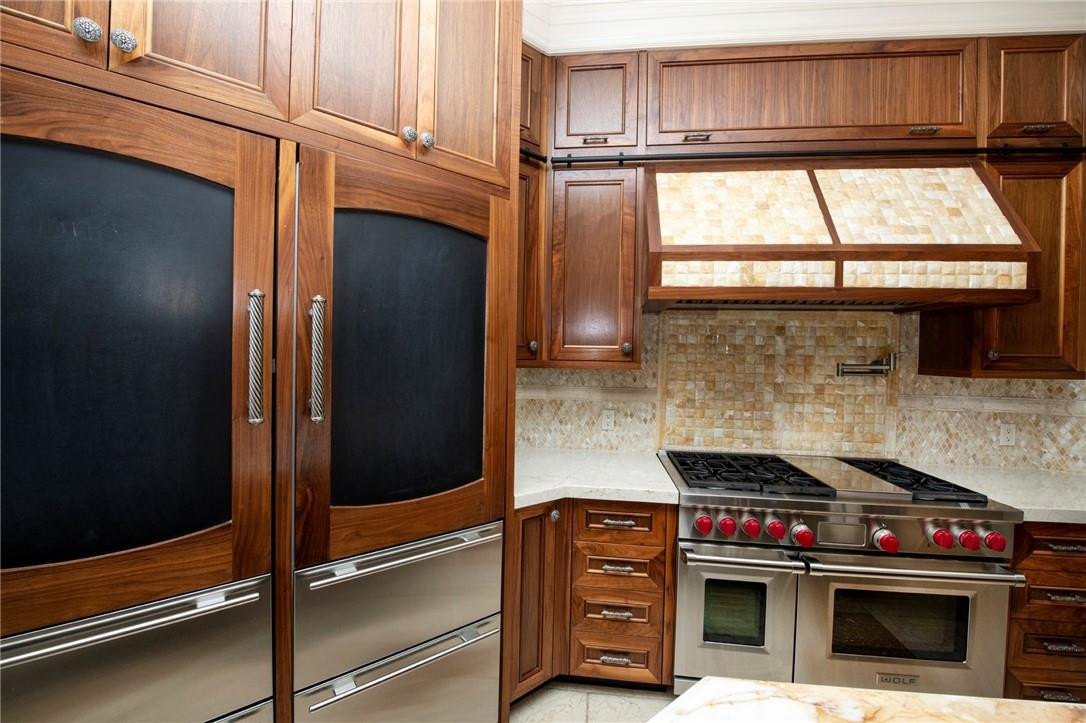 6468 Northwest 31st Way Boca Raton, FL 33496 - Photo 15 of 43 a kitchen with granite countertop a stove and a cabinet