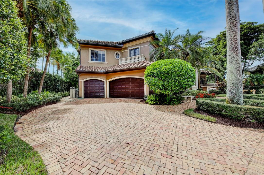 6468 Northwest 31st Way Boca Raton, FL 33496 - Photo 2 of 43 a front view of a house with garden