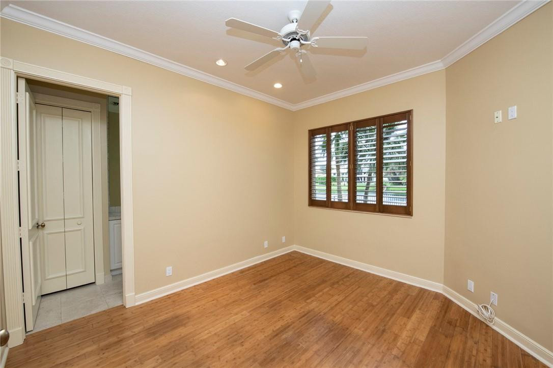 6468 Northwest 31st Way Boca Raton, FL 33496 - Photo 21 of 43 a view of an empty room with window and wooden floor