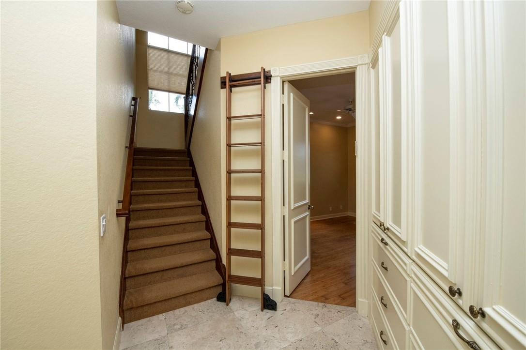 6468 Northwest 31st Way Boca Raton, FL 33496 - Photo 23 of 43 a view of a hallway with staircase and white door
