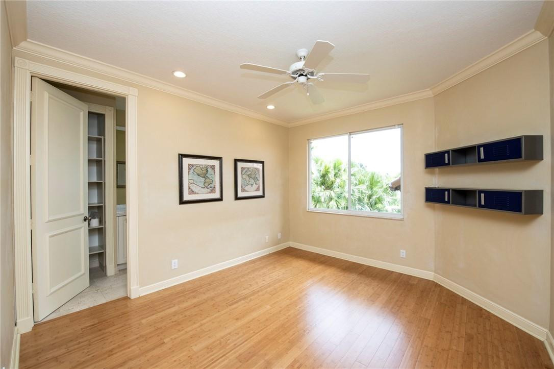 6468 Northwest 31st Way Boca Raton, FL 33496 - Photo 24 of 43 a view of an empty room with a window and wooden floor