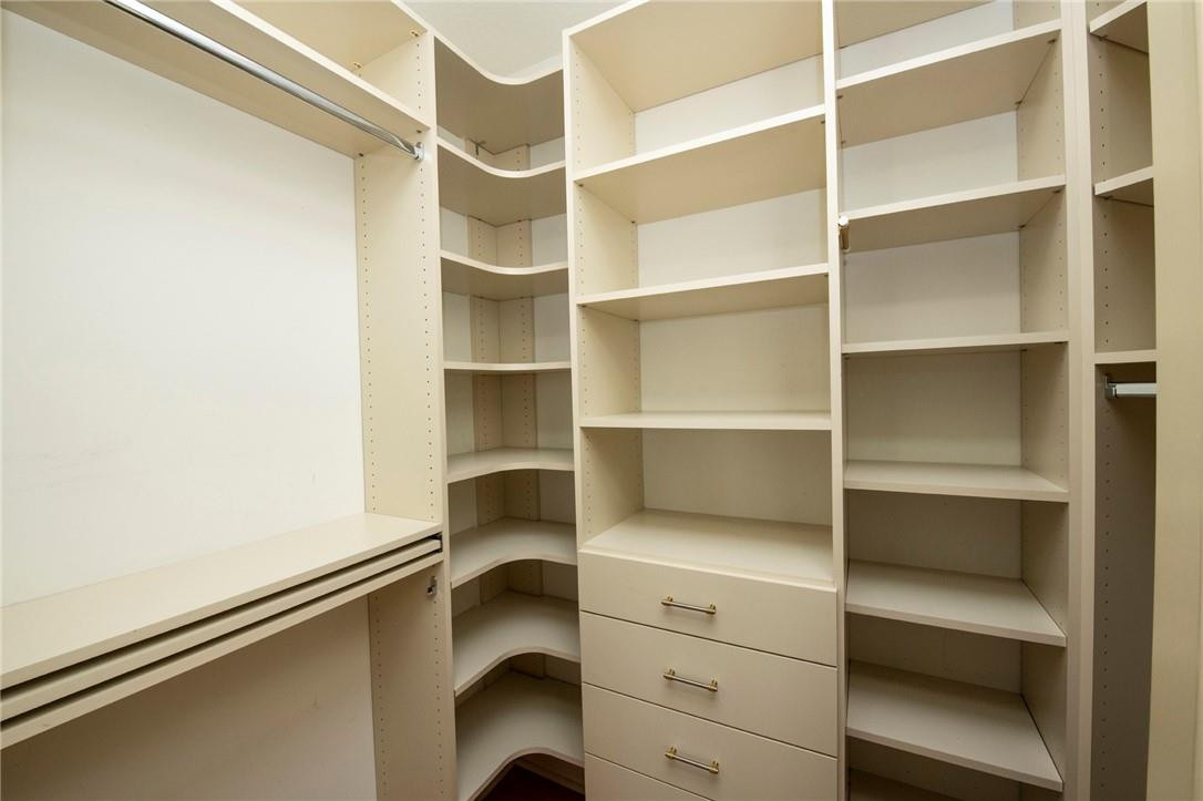 6468 Northwest 31st Way Boca Raton, FL 33496 - Photo 30 of 43 a view of walk in closet with empty racks