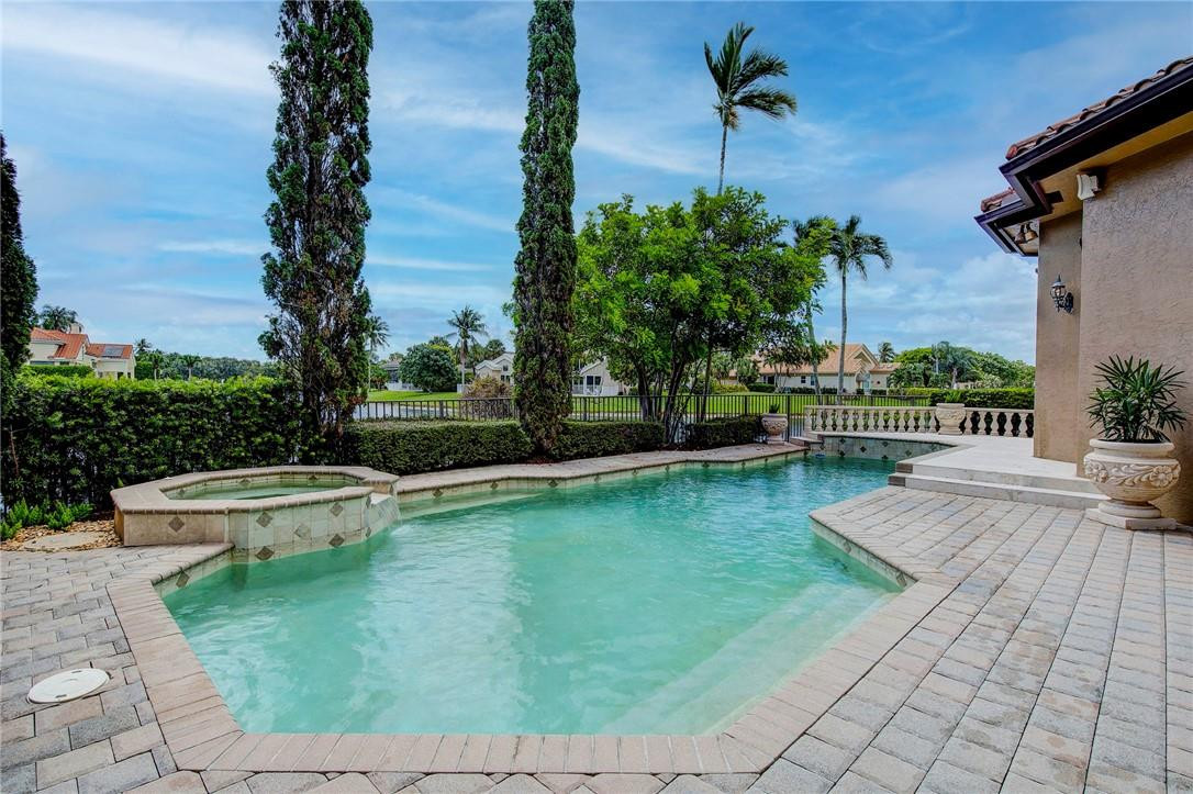 6468 Northwest 31st Way Boca Raton, FL 33496 - Photo 35 of 43 a view of a swimming pool with a patio