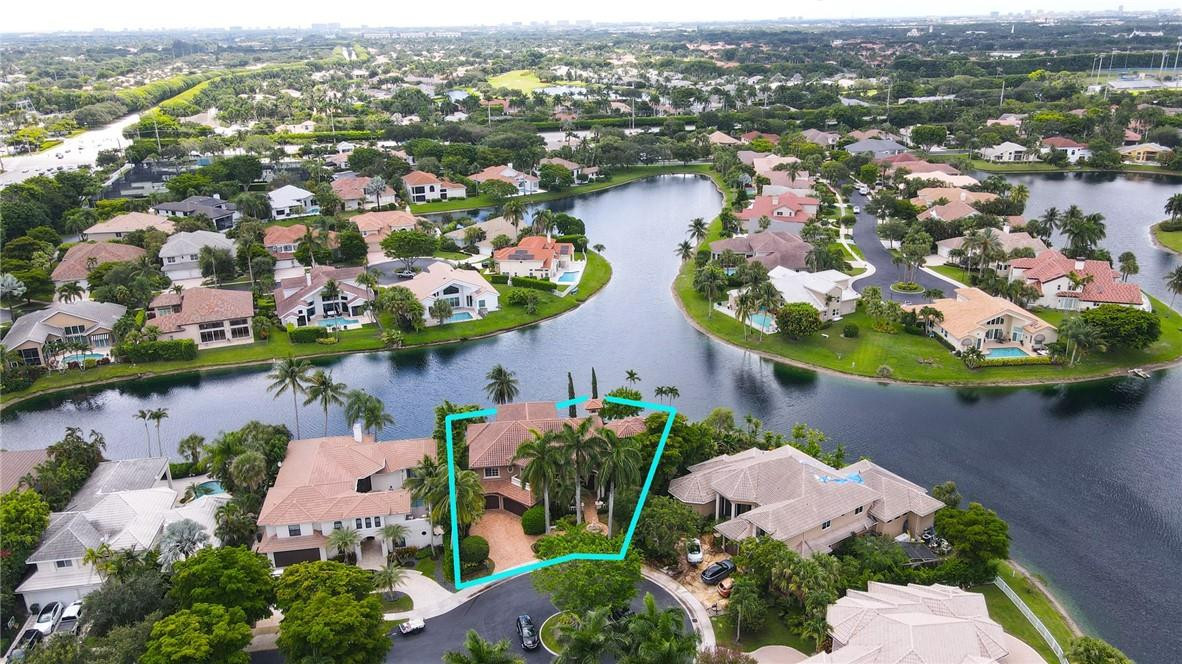 6468 Northwest 31st Way Boca Raton, FL 33496 - Photo 39 of 43 an aerial view of lake and residential houses with outdoor space and swimming pool